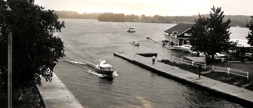 A boat in the water in the Township by the docks