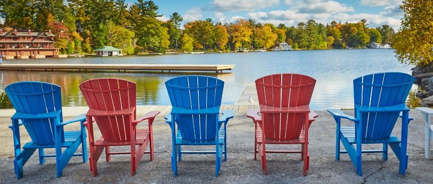 5 Muskoka Chairs on a Dock Overlooking the River